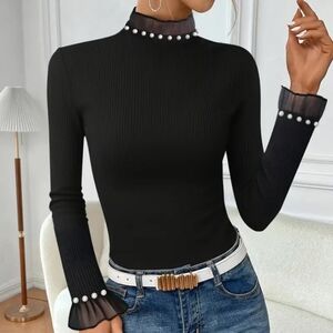 Such an elegant black Pearled soft ribbed turtleneck top.